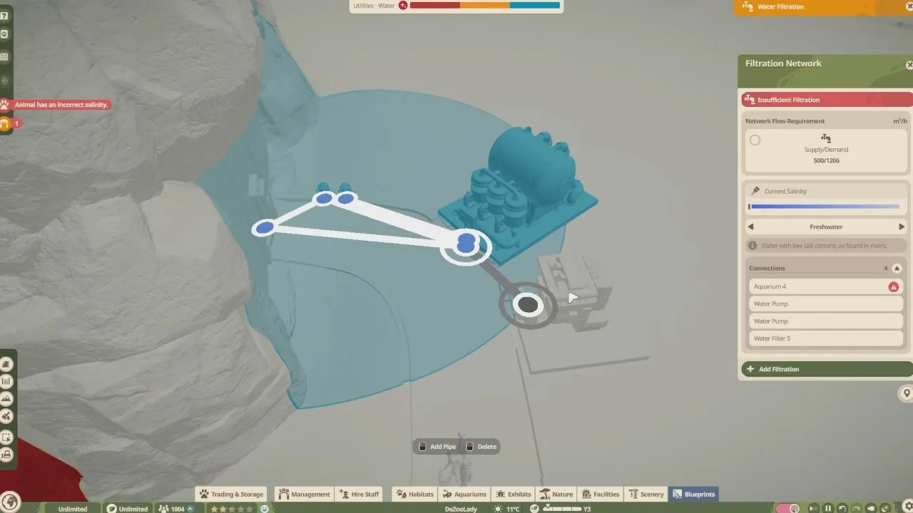 Planet Zoo 2 aquarium water pump radius and connected filtration nodes beside the tank